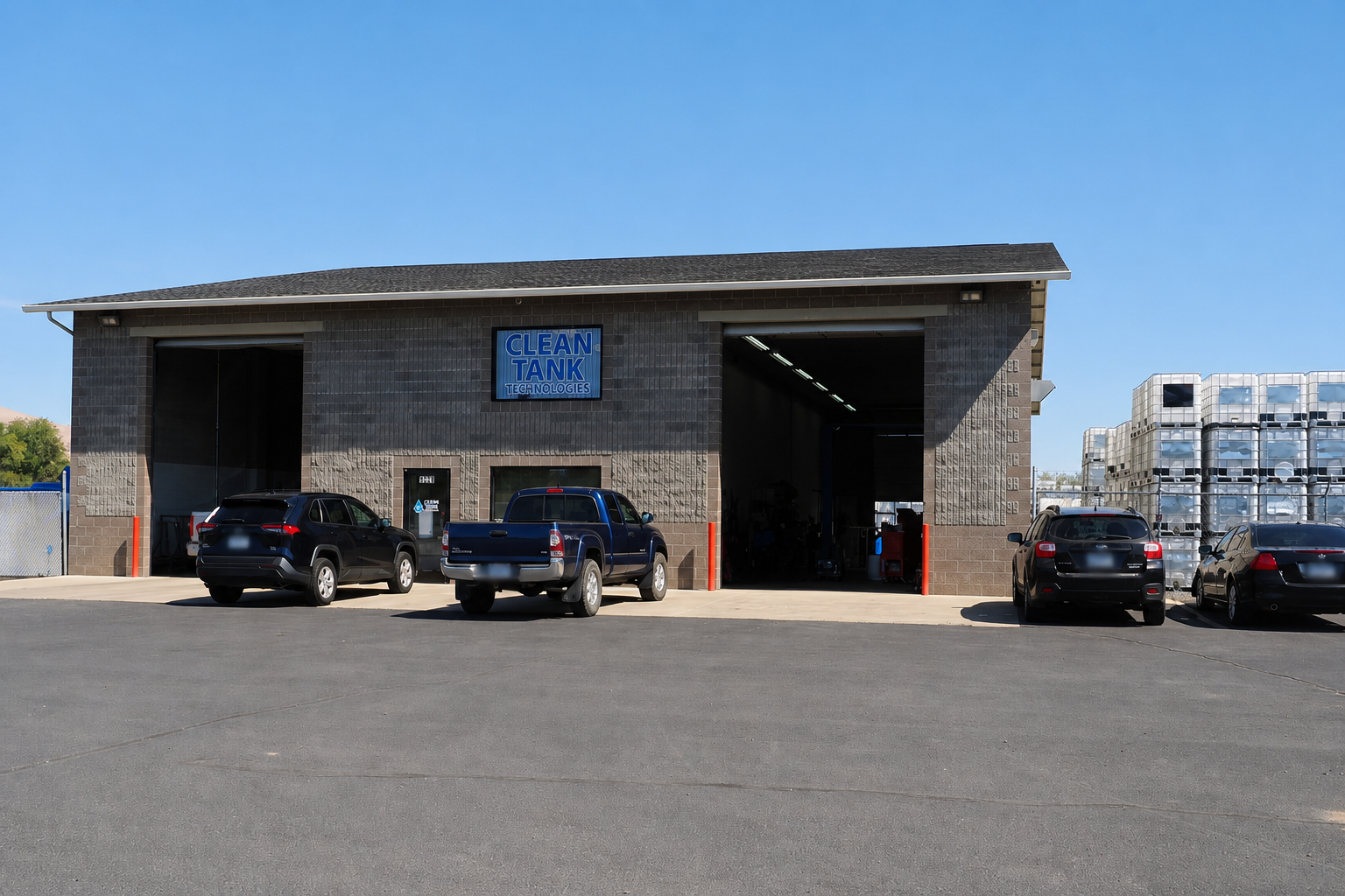 Clean Tank Technologies production building in Yakima with stacked IBCs beside the facility