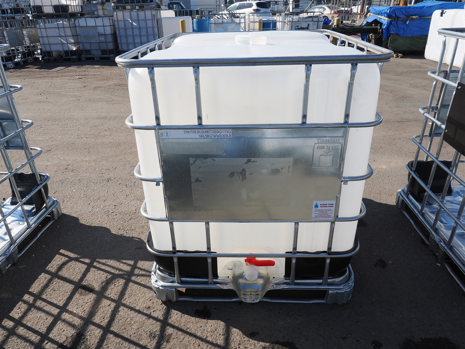 Clean Tank IBC showing the bottle, cage, faceplate, UN specification marking, pallet and valve