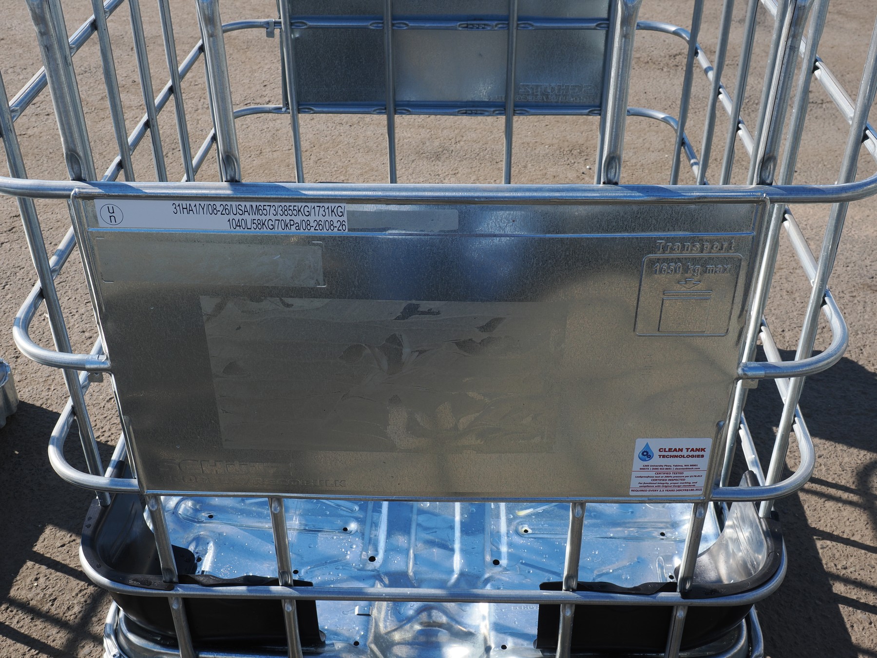 Actual IBC faceplate with a UN specification marking and Clean Tank approval number M6573